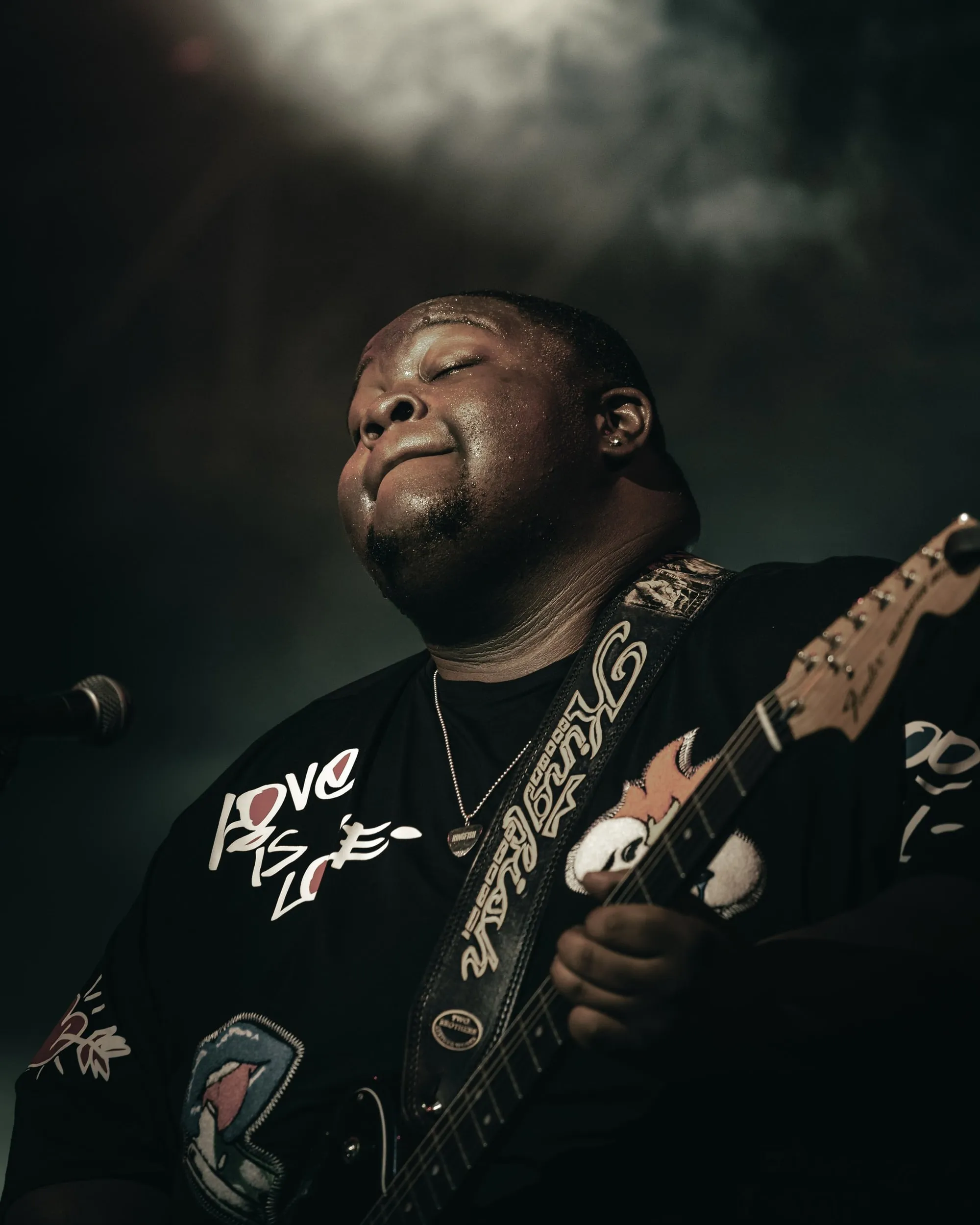 Guitarist under the haze at Bluesfest Byron Bay, 2022, photographed by Kris Cook