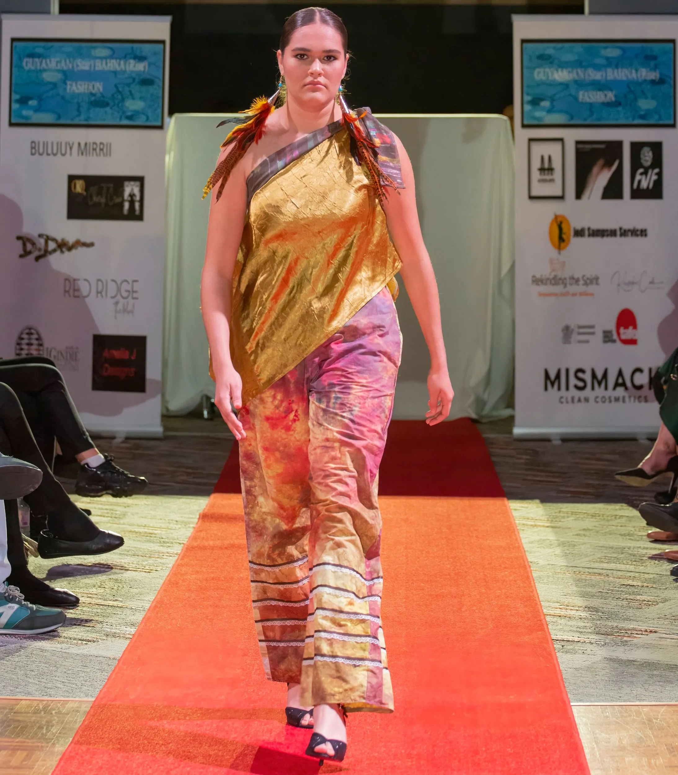 Feathers and gold on the red carpet at the Guyamgan Bahna Fashion Show, Gold Coast, 2022, photographed by Kris Cook