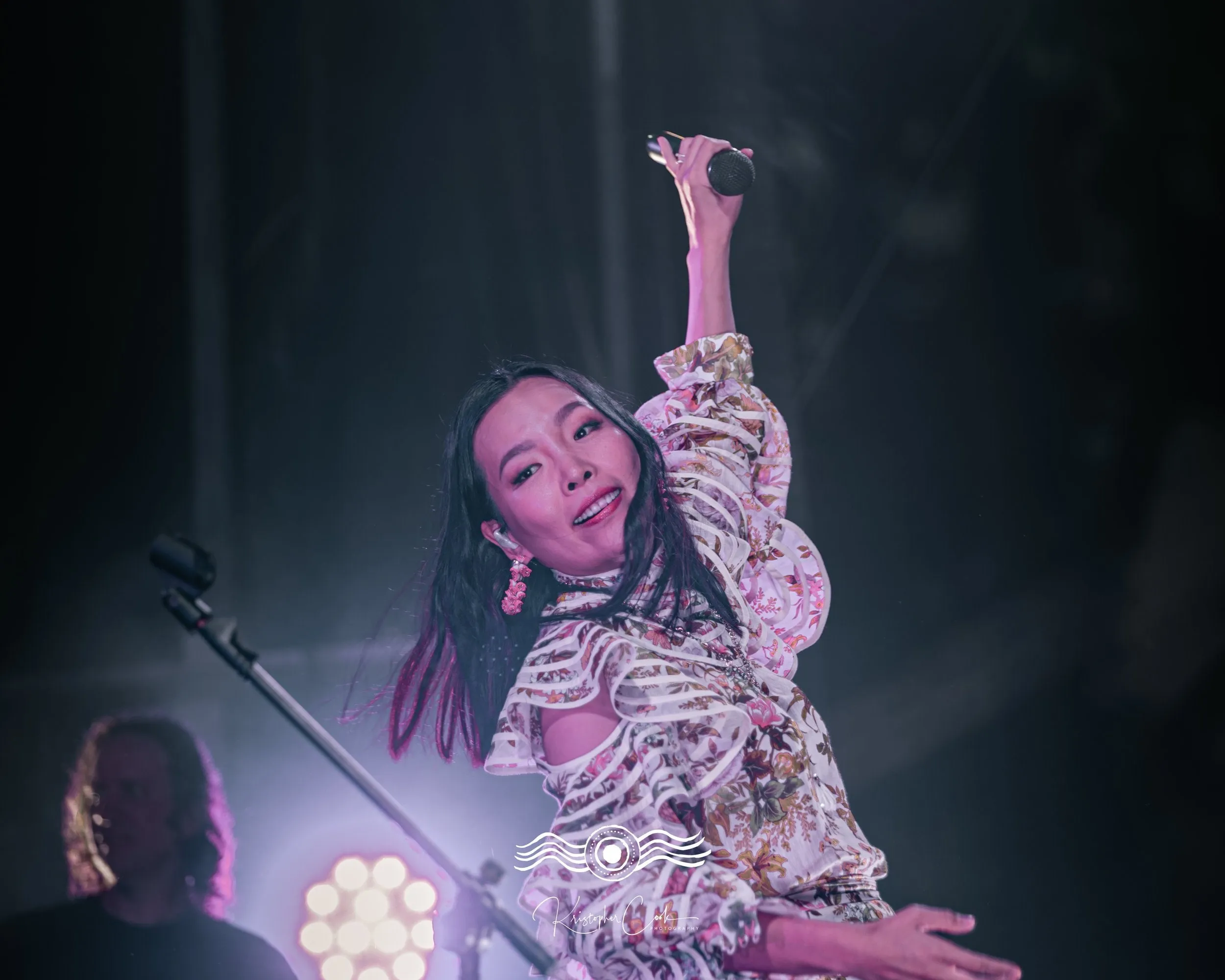 Arm to the sky in a floral dress at Groove on the Grass, Grafton, 2023, photographed by Kris Cook