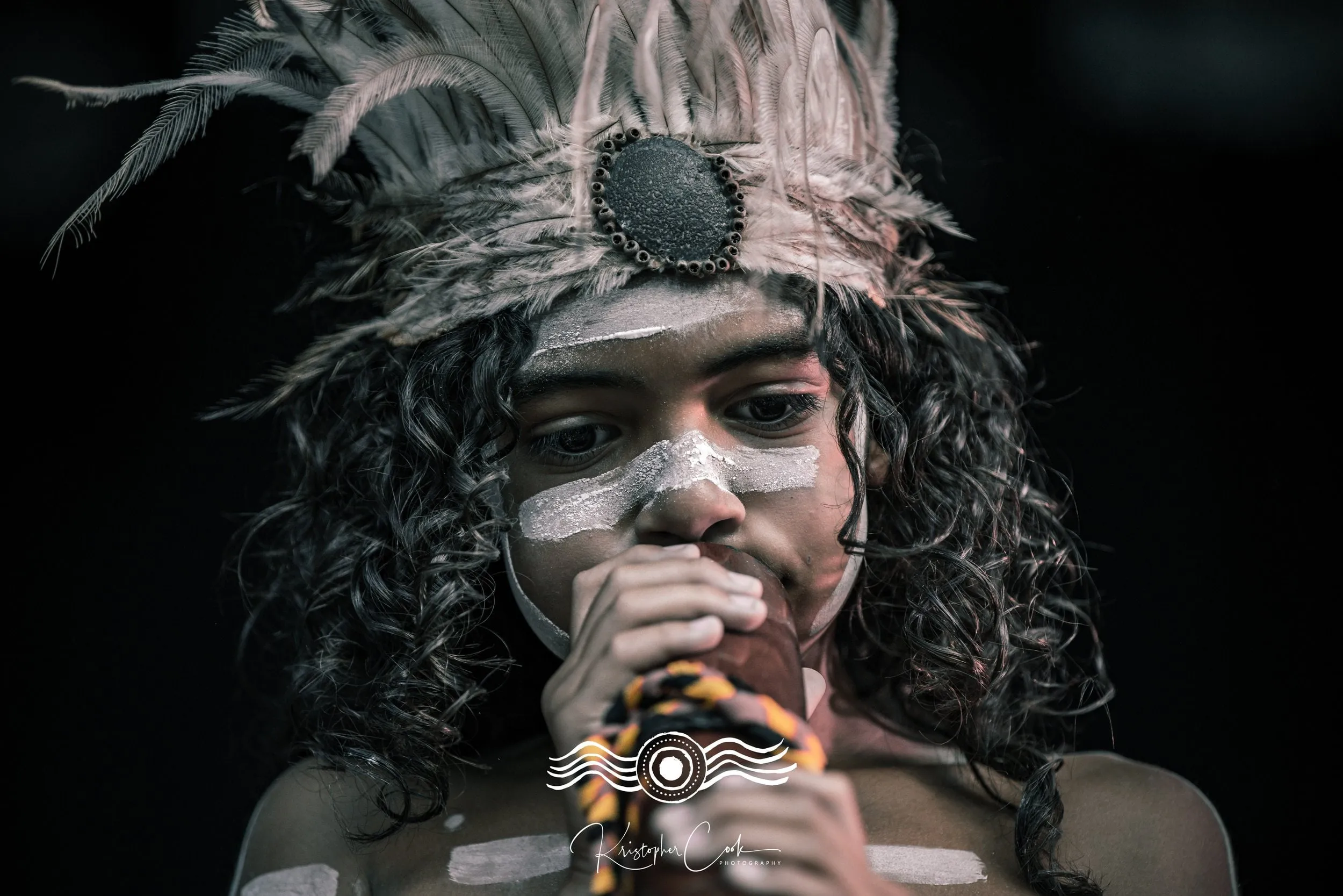Young player with the didge at Groove on the Grass, Grafton, 2023, photographed by Kris Cook