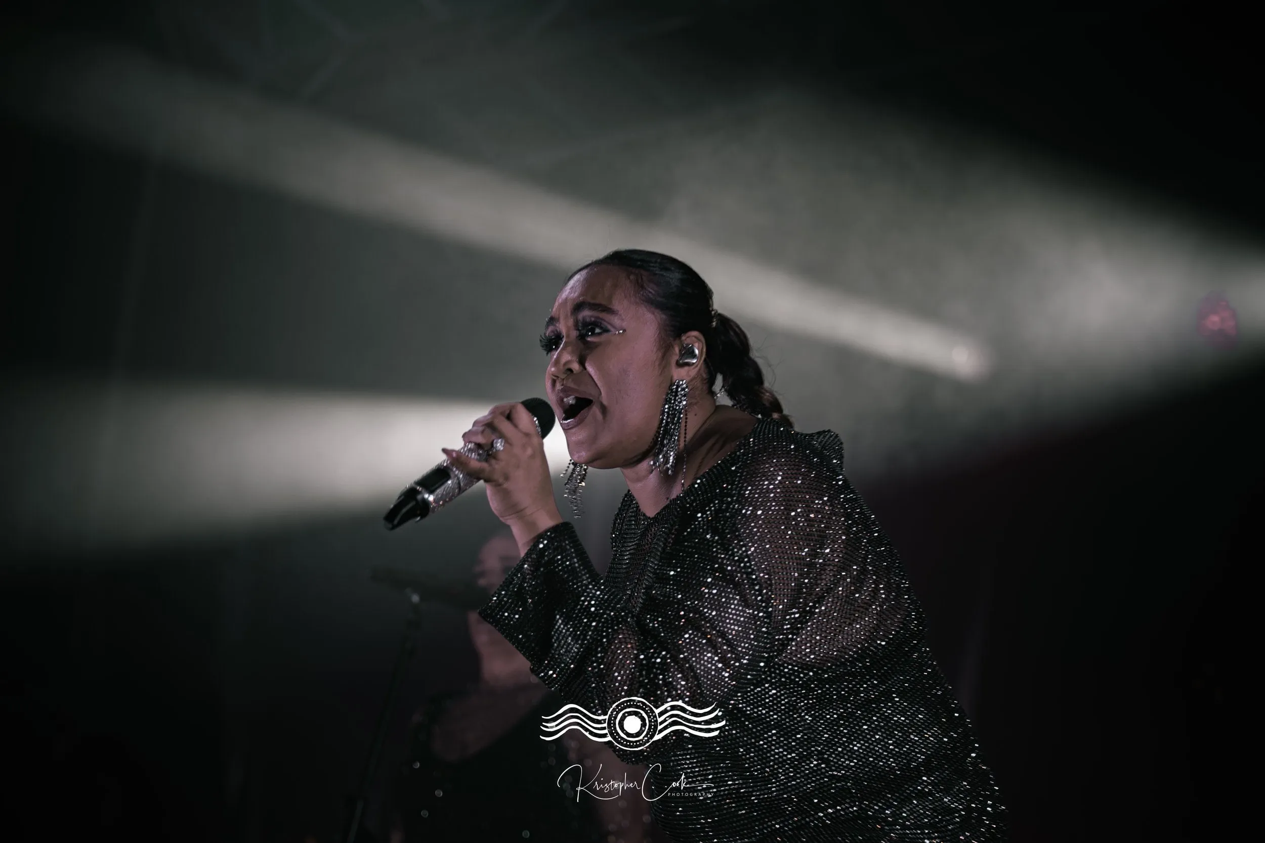 Singer in the haze on stage at Groove on the Grass, Market Square, Grafton, 2023, photographed by Kris Cook