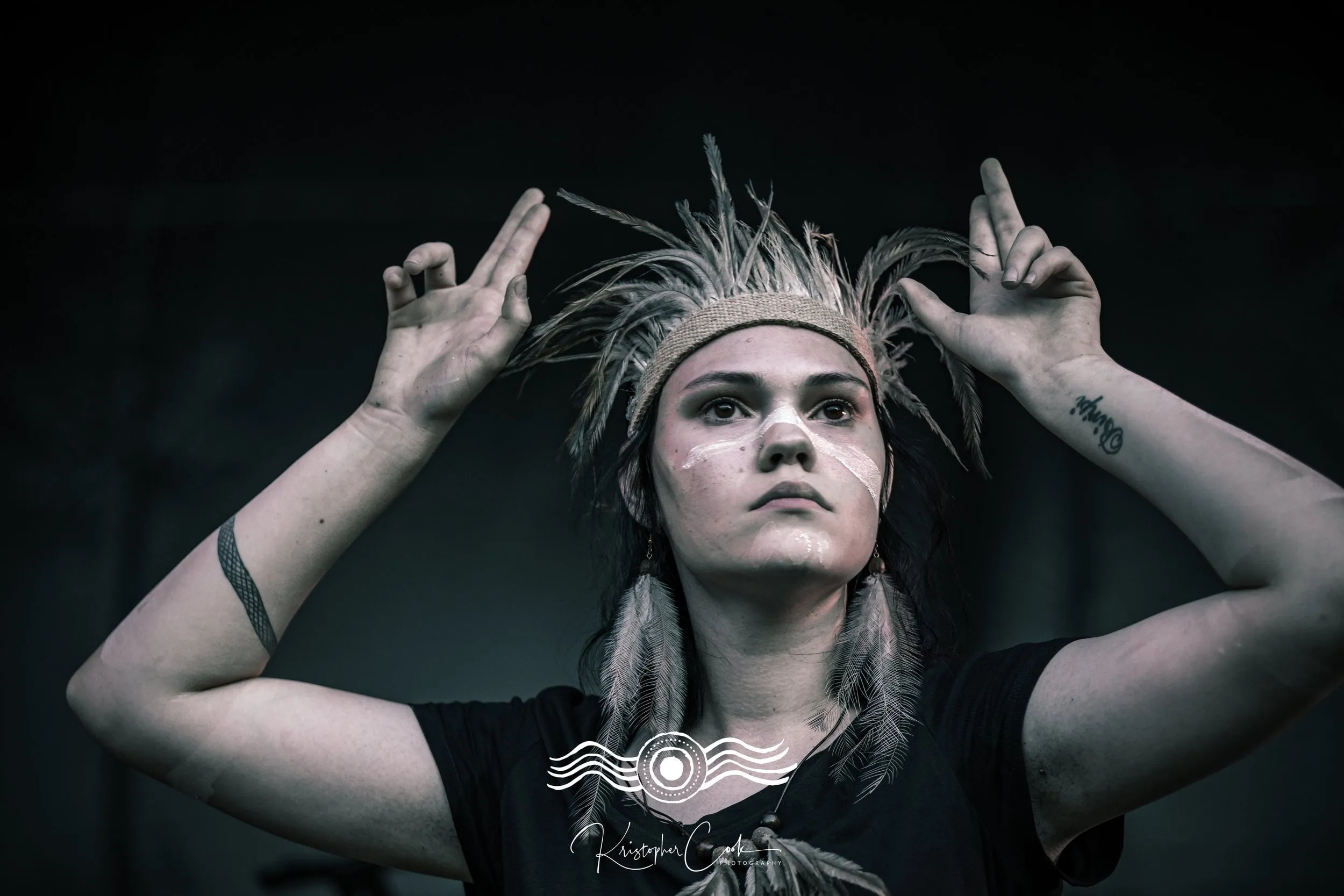 Dancer in a feathered headband at Groove on the Grass, Grafton, 2023, photographed by Kris Cook